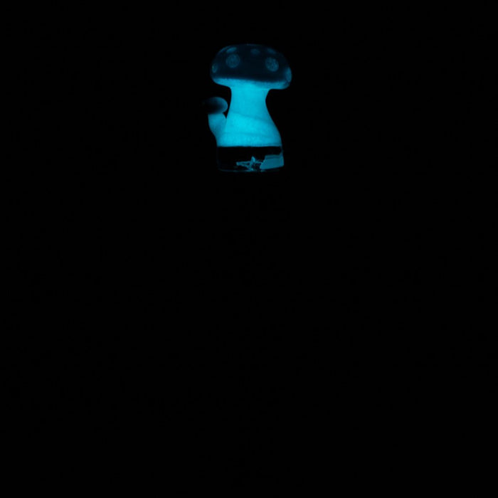 Empire Glassworks Blue Mushroom Puffco Pivot Mouthpiece glowing in the dark