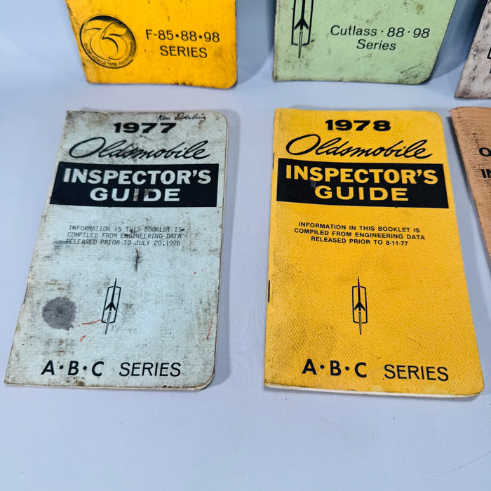 Vintage Oldsmobile Inspector’s Guide Lot (1973–1979) — 8 Pocket Manuals, Codes & Specs (Cutlass / 88 / 98 / F-85 / A-B-C)